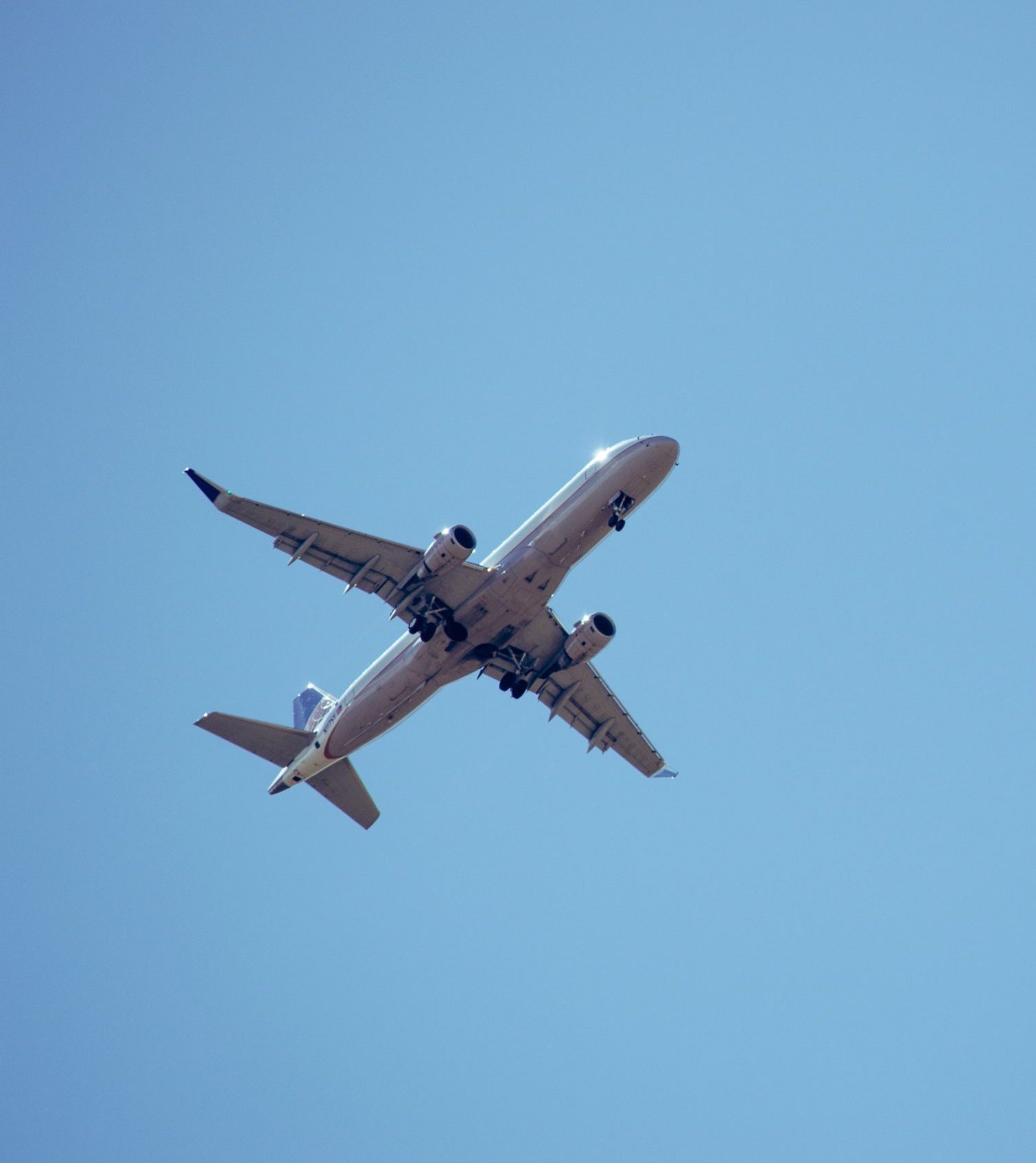 airplane against blue sky